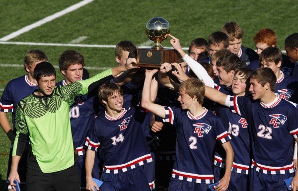 Bangor Christian's Brad Wilcox (14) and Seth Pearson (2) lead the Patriots after receiving the trophy for winning the Class D soccer state championship victory over Greenville in Falmouth on Saturday, Nov. 5, 2011. Bangor Christian's Brad Wilcox (14) and Seth Pearson (2) lead the Patriots after receiving the trophy for winning the Class D soccer state championship victory over Greenville in Falmouth on Saturday, Nov. 5, 2011.