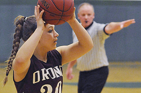 Orono High School's Caleigh Paul looks for an open teammate in the first period of Tuesday night's game at Old Town High School. Orono High School's Caleigh Paul looks for an open teammate in the first period of Tuesday night's game at Old Town High School.