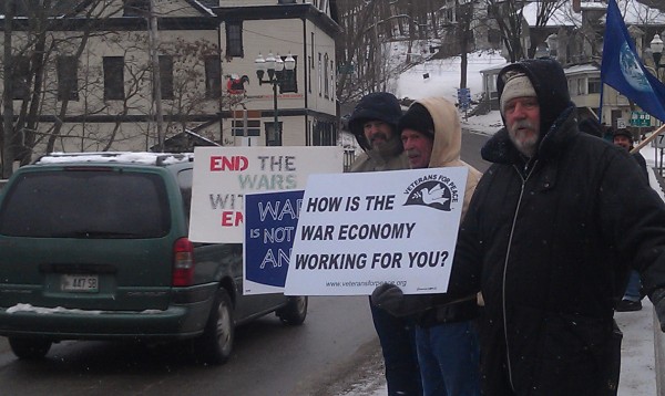 Demonstrators display signs and wave at passersby around noon on Christmas Day on Ellsworth's Union River Bridge. The demonstrations are a Sunday tradition for many of them, and they said their messages should hit home during the holidays. Demonstrators display signs and wave at passersby around noon on Christmas Day on Ellsworth's Union River Bridge. The demonstrations are a Sunday tradition for many of them, and they said their messages should hit home during the holidays.