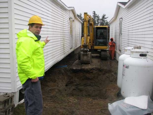 Jon Woodard of the Maine Department of Environmental Protection points out the site of the copper theft as Walter Purcell, a field technician for Boom Technology in Gorham, prepares to work on tubing for one of the propane tanks Wednesday, Dec. 7. Jon Woodard of the Maine Department of Environmental Protection points out the site of the copper theft as Walter Purcell, a field technician for Boom Technology in Gorham, prepares to work on tubing for one of the propane tanks Wednesday, Dec. 7.