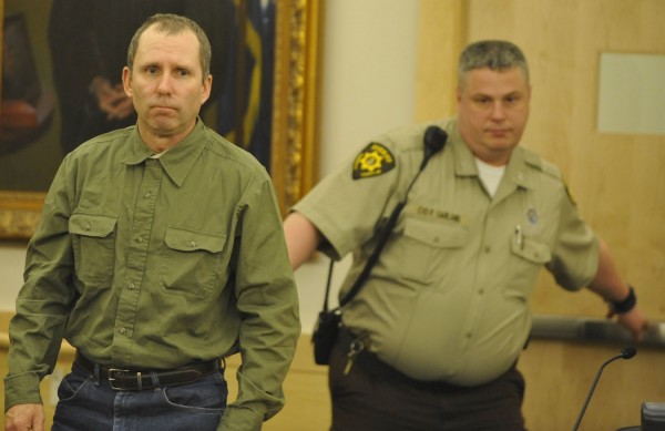 Peter Robinson enters the courtroom for his bail hearing escorted by Penobscot County Sheriff's Department corrections officer Peter Garland at Penobscot Judicial Center Friday, Dec. 2, 2011. Peter Robinson enters the courtroom for his bail hearing escorted by Penobscot County Sheriff's Department corrections officer Peter Garland at Penobscot Judicial Center Friday, Dec. 2, 2011.
