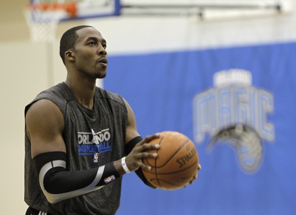 Orlando Magic center Dwight Howard shoots free throws after practice on the first day of NBA basketball training camp in Orlando, Fla., Friday, Dec. 9, 2011 Orlando Magic center Dwight Howard shoots free throws after practice on the first day of NBA basketball training camp in Orlando, Fla., Friday, Dec. 9, 2011