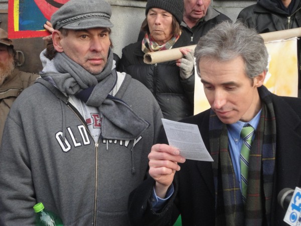 OccupyMaine attorney John Branson (right) reads Section 2, Article 1 of the Maine Constitution's Declaration of Rights on Monday afternoon on the steps of the Cumberland County Courthouse. The article states: "All power is inherent in the people; all free governments are founded in their authority and instituted for their benefit; they have therefore an unalienable and indefeasible right to institute government, and to alter, reform, or totally change the same, when their safety and happiness require it." Branson, who filed a lawsuit against Portland on behalf of OccupyMaine, is joined by Frederick Deese Hamilton, one of four individuals named as plaintiffs in the suit. OccupyMaine attorney John Branson (right) reads Section 2, Article 1 of the Maine Constitution's Declaration of Rights on Monday afternoon on the steps of the Cumberland County Courthouse. The article states: "All power is inherent in the people; all free governments are founded in their authority and instituted for their benefit; they have therefore an unalienable and indefeasible right to institute government, and to alter, reform, or totally change the same, when their safety and happiness require it." Branson, who filed a lawsuit against Portland on behalf of OccupyMaine, is joined by Frederick Deese Hamilton, one of four individuals named as plaintiffs in the suit.