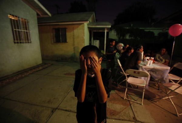 Jese Castillo, 11, covers his eyes as he plays during his birthday party on Sept. 13, 2011, in Los Angeles, California. Jese is autistic and is making progress in his social skills. After spending his 10th birthday party mostly alone, he played with his cousins at his 11th. Jese Castillo, 11, covers his eyes as he plays during his birthday party on Sept. 13, 2011, in Los Angeles, California. Jese is autistic and is making progress in his social skills. After spending his 10th birthday party mostly alone, he played with his cousins at his 11th.