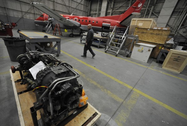 Aaron Bryant of Ellsworth, a spray technician at C&L Aerospace, an international aircraft supplier and maintainer, walks amidst the engines, fuselages and other airplane parts old and new at its Maine office in Bangor Friday afternoon, Dec. 16, 2011. Aaron Bryant of Ellsworth, a spray technician at C&L Aerospace, an international aircraft supplier and maintainer, walks amidst the engines, fuselages and other airplane parts old and new at its Maine office in Bangor Friday afternoon, Dec. 16, 2011.