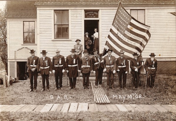 An empty right sleeve identifies Ira Gardner as the second man from the left when members of the Edwin S. Rogers Post, Grand Army of the Republic, formed up in Patten on May 30, 1908. An empty right sleeve identifies Ira Gardner as the second man from the left when members of the Edwin S. Rogers Post, Grand Army of the Republic, formed up in Patten on May 30, 1908.