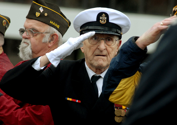 Pearl Harbor survivor Robert Coles, 87, of Machias salutes the flag as the Bangor High School band plays the national anthem during a Pearl Harbor remembrance ceremony on the Kenduskeag walking bridge on Wednesday, Dec. 7, 2011. Coles was a chief radio man in the U.S. Navy and was two weeks shy of his 18th birthday the day Pearl Harbor was bombed. Coles will turn 88 on December 21, 2011. Pearl Harbor survivor Robert Coles, 87, of Machias salutes the flag as the Bangor High School band plays the national anthem during a Pearl Harbor remembrance ceremony on the Kenduskeag walking bridge on Wednesday, Dec. 7, 2011. Coles was a chief radio man in the U.S. Navy and was two weeks shy of his 18th birthday the day Pearl Harbor was bombed. Coles will turn 88 on December 21, 2011.