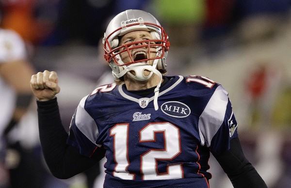 New England Patriots quarterback Tom Brady (12) celebrates after scoring a one yard touchdown during the second half of the AFC Championship NFL football game against the Baltimore Ravens Sunday, Jan. 22, 2012, in Foxborough, Mass. New England Patriots quarterback Tom Brady (12) celebrates after scoring a one yard touchdown during the second half of the AFC Championship NFL football game against the Baltimore Ravens Sunday, Jan. 22, 2012, in Foxborough, Mass.