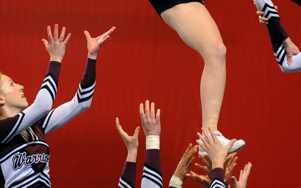 The Nokomis Regional High School cheering squad performs their routine during the Class B Regional Cheerleading Competitions in Bangor Saturday. The Nokomis Regional High School cheering squad performs their routine during the Class B Regional Cheerleading Competitions in Bangor Saturday.