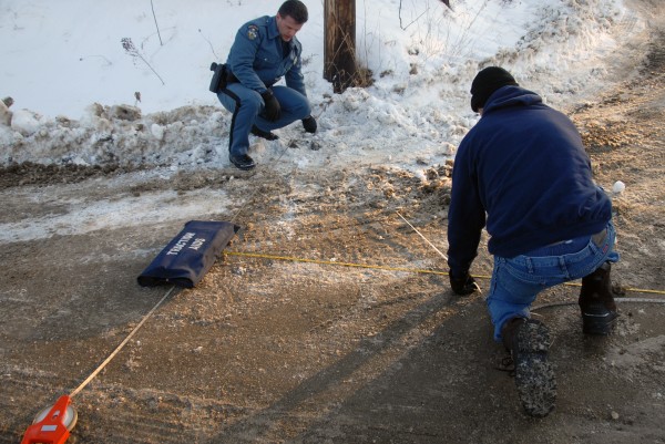 State police Trooper Thomas Fiske (left) and Trooper Larry Anderson take measurements at an accident scene at Ariel and Clark streets in Lincoln on Wednesday, Jan. 18, 2011. Police identified the victim the following day as Sophia Nelson, 6, of Lincoln. State police Trooper Thomas Fiske (left) and Trooper Larry Anderson take measurements at an accident scene at Ariel and Clark streets in Lincoln on Wednesday, Jan. 18, 2011. Police identified the victim the following day as Sophia Nelson, 6, of Lincoln.