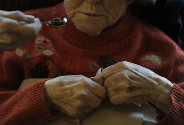 Lillian Davis clutches her napkins as her daughter Susan Philbrick feeds her bean soup at the Orono Commons nursing home. Lillian is a high-cost Maine Care user. Lillian Davis clutches her napkins as her daughter Susan Philbrick feeds her bean soup at the Orono Commons nursing home. Lillian is a high-cost Maine Care user.