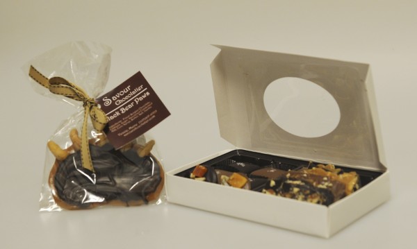 Perfect for candy connoisseurs, Savour Chocolatier offers a full array of decadent chocolates. Pictured are the sweet shop’s Black Bear Paws and a box of assorted brittles, Maine sea salt caramels, and mendiants. Perfect for candy connoisseurs, Savour Chocolatier offers a full array of decadent chocolates. Pictured are the sweet shop’s Black Bear Paws and a box of assorted brittles, Maine sea salt caramels, and mendiants.