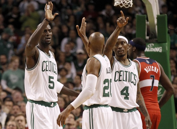 Boston Celtics' Kevin Garnett (5), Ray Allen and Marquis Daniels (4) celebrate after a basket during the second half of Boston's 100-92 win over the Washington Wizards in an NBA basketball game in Boston Monday night, Jan. 2, 2012. Boston Celtics' Kevin Garnett (5), Ray Allen and Marquis Daniels (4) celebrate after a basket during the second half of Boston's 100-92 win over the Washington Wizards in an NBA basketball game in Boston Monday night, Jan. 2, 2012.