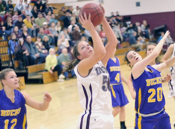 Orono girls basketball player Jillian Woodward (50) sets her sights on the basket over Bucksport defenders Mindy Pye (12) and Bailey Blair (20) in the first half of their game in Orono Thursday, Jan. 5, 2012. Orono girls basketball player Jillian Woodward (50) sets her sights on the basket over Bucksport defenders Mindy Pye (12) and Bailey Blair (20) in the first half of their game in Orono Thursday, Jan. 5, 2012.