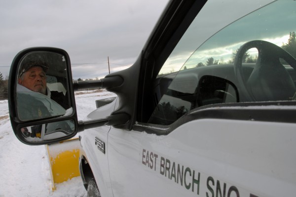 East Branch Sno-Rovers club member Maynard Michaud awaits a load of snow for distribution onto the drag-racing snowmobile track at the club on Saturday, Jan. 14, 2012. East Branch Sno-Rovers club member Maynard Michaud awaits a load of snow for distribution onto the drag-racing snowmobile track at the club on Saturday, Jan. 14, 2012.