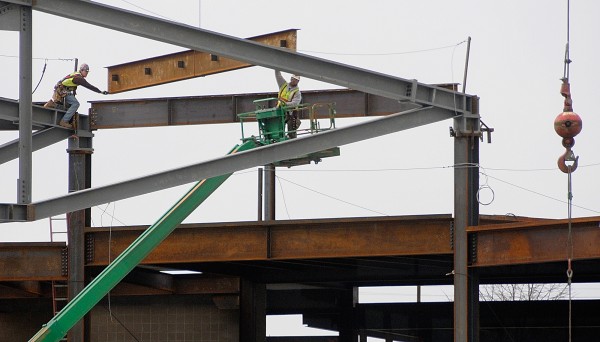 Workers in their safety harnesses carefully position a crane-hoisted roof beam into place atop the new Bangor Arena on Friday morning, Feb. 24, 2012. With the help of unseasonably warm weather, the arena construction remains on schedule. Workers in their safety harnesses carefully position a crane-hoisted roof beam into place atop the new Bangor Arena on Friday morning, Feb. 24, 2012. With the help of unseasonably warm weather, the arena construction remains on schedule.