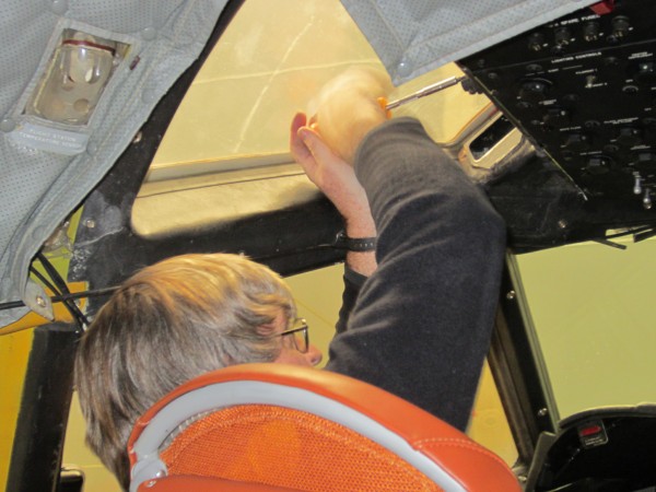 Mechanic Kelly Silcox of California-based Aircraft Deconstructors International tightens a screw on a new windshield on a P3 owned by the Brazilian Air Force. Silcox is one of a crew of four in Brunswick this week repairing the former U.S. Navy sub chaser. Mechanic Kelly Silcox of California-based Aircraft Deconstructors International tightens a screw on a new windshield on a P3 owned by the Brazilian Air Force. Silcox is one of a crew of four in Brunswick this week repairing the former U.S. Navy sub chaser.