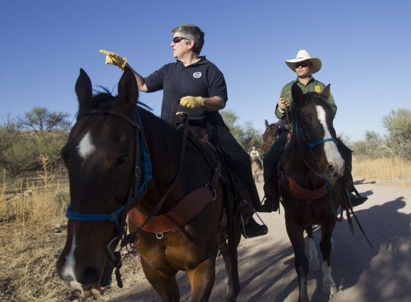 In this Oct. 30, 2011, file photo Homeland Security Secretary Janet Napolitano, left, tours the U.S.-Mexico border with Border Patrol agent Steve Venditouli in the Coronado National Forest near Nogales, Ariz. Most illegal border crossers are apprehended along the 2,000-mile long Mexican border in California, Arizona, New Mexico, and Texas. In this Oct. 30, 2011, file photo Homeland Security Secretary Janet Napolitano, left, tours the U.S.-Mexico border with Border Patrol agent Steve Venditouli in the Coronado National Forest near Nogales, Ariz. Most illegal border crossers are apprehended along the 2,000-mile long Mexican border in California, Arizona, New Mexico, and Texas.