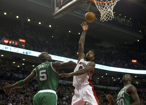Amir Johnson of the Toronto Raptors lays the ball up as Kevin Garnett of the Boston Celtics and Brandon Bass look on during the second half of play in Toronto on Friday, Feb.10, 2012. Amir Johnson of the Toronto Raptors lays the ball up as Kevin Garnett of the Boston Celtics and Brandon Bass look on during the second half of play in Toronto on Friday, Feb.10, 2012.
