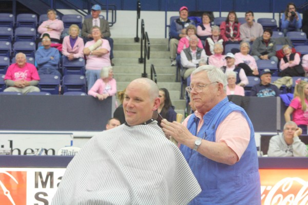 University of Maine women's basketball coach Richard Barron can't help but smile as Orono barber Erv Morrison finishes shaving his head after Wednesday night's game against Hartford at Alfond Arena in Orono. Barron promised to shave his head if UMaine fans donated $10,000 to the Kay Yow Foundation. UMaine surpassed the goal. University of Maine women's basketball coach Richard Barron can't help but smile as Orono barber Erv Morrison finishes shaving his head after Wednesday night's game against Hartford at Alfond Arena in Orono. Barron promised to shave his head if UMaine fans donated $10,000 to the Kay Yow Foundation. UMaine surpassed the goal.