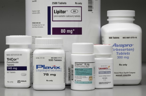 In this June 14, 2011, file photo, bottles of prescription drugs as labeled Lipitor, TriCor, Plavix, Singulair, Lexapro and Avapro are displayed at Medco Health Solutions Inc., in Willingboro, N.J. In this June 14, 2011, file photo, bottles of prescription drugs as labeled Lipitor, TriCor, Plavix, Singulair, Lexapro and Avapro are displayed at Medco Health Solutions Inc., in Willingboro, N.J.
