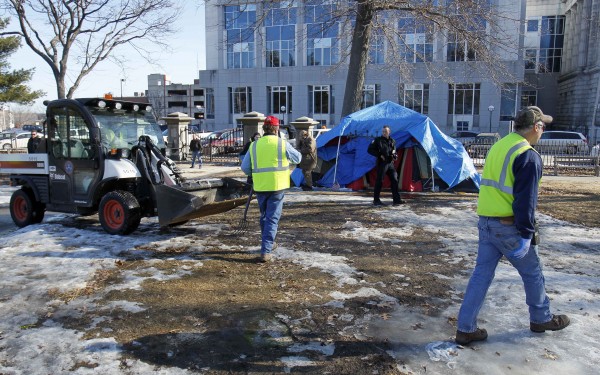 Police and city workers move in to clear out the Occupy Maine encampment during a peaceful eviction from Lincoln Park, Friday, Feb. 10, 2012, in Portland, Maine. Police and city workers move in to clear out the Occupy Maine encampment during a peaceful eviction from Lincoln Park, Friday, Feb. 10, 2012, in Portland, Maine.