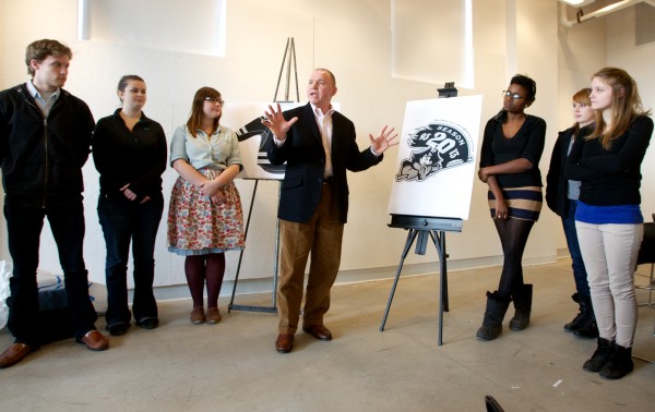 Portland Pirates hockey team CEO Brian Petrovek (center, flanked by students) speaks at a press conference Monday, Feb. 27, 2012, unveiling a new, 20th anniversary logo designed by students at the Maine College of Art. Portland Pirates hockey team CEO Brian Petrovek (center, flanked by students) speaks at a press conference Monday, Feb. 27, 2012, unveiling a new, 20th anniversary logo designed by students at the Maine College of Art.