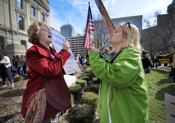 Planned Parenthood supporter Peg Paulson of Carmel, Ind. (left} and opponent Heather Pruett of Indianapolis argue during a rally last year at the Indiana Statehouse on the South Lawn in Indianapolis. Planned Parenthood supporter Peg Paulson of Carmel, Ind. (left} and opponent Heather Pruett of Indianapolis argue during a rally last year at the Indiana Statehouse on the South Lawn in Indianapolis.