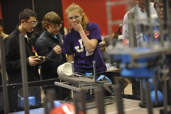 John Bapst Memorial High School junior Bethany Waanders,16, appears to hold her breath as she, Bapst teammates Leland Mushrall (left),15, and G. Leaden remotely control their robot as it performs navigational and dexterity tasks during Saturday's VEX Robotics Competition at the Bangor Auditorium. John Bapst Memorial High School junior Bethany Waanders,16, appears to hold her breath as she, Bapst teammates Leland Mushrall (left),15, and G. Leaden remotely control their robot as it performs navigational and dexterity tasks during Saturday's VEX Robotics Competition at the Bangor Auditorium.