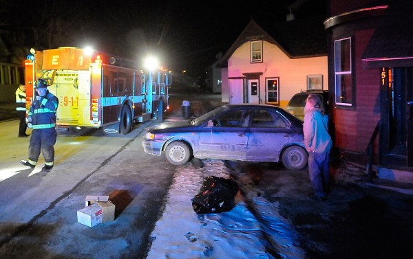 Bangor firefighters and police respond to an accident on 151 Ohio Street in Bangor around 8:45 p.m. Monday, Feb.13, 2012. A car backed into the home there after the driver was unable to stop it rolling backwards from her driveway across the street. The woman suffered knee abrasions while trying to stop the vehicle from rolling and was transported to a nearby hospital. Bangor firefighters and police respond to an accident on 151 Ohio Street in Bangor around 8:45 p.m. Monday, Feb.13, 2012. A car backed into the home there after the driver was unable to stop it rolling backwards from her driveway across the street. The woman suffered knee abrasions while trying to stop the vehicle from rolling and was transported to a nearby hospital.
