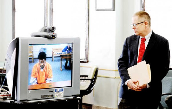 Cleveland Cruthirds (on screen) confers with his attorney, James Howaniec, during his arraignment at the Androscoggin County Superior Court law library in Auburn on Friday. Cruthirds is being held at the Maine State Prison in Warren and made his not-guilty plea by videoconference. Cleveland Cruthirds (on screen) confers with his attorney, James Howaniec, during his arraignment at the Androscoggin County Superior Court law library in Auburn on Friday. Cruthirds is being held at the Maine State Prison in Warren and made his not-guilty plea by videoconference.