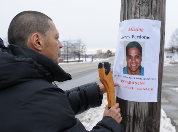 Jerry Perdomo Sr. tacks a missing person poster on a telephone pole outside the Bangor Fire Department's central station on Saturday, Feb. 25, 2012. Perdomo's son, Jerry Perdomo Jr. has been missing since Feb. 16, 2012. Jerry Perdomo Sr. tacks a missing person poster on a telephone pole outside the Bangor Fire Department's central station on Saturday, Feb. 25, 2012. Perdomo's son, Jerry Perdomo Jr. has been missing since Feb. 16, 2012.