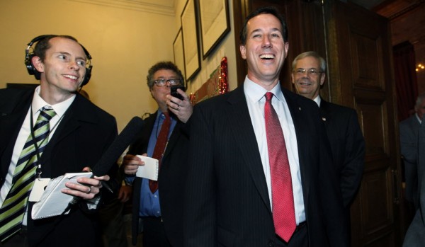 Republican presidential candidate, former Pennsylvania Sen. Rick Santorum laughs in response to a reporter's question as he leaves a news conference Monday, Feb. 13, in Olympia, Wash. Republican presidential candidate, former Pennsylvania Sen. Rick Santorum laughs in response to a reporter's question as he leaves a news conference Monday, Feb. 13, in Olympia, Wash.