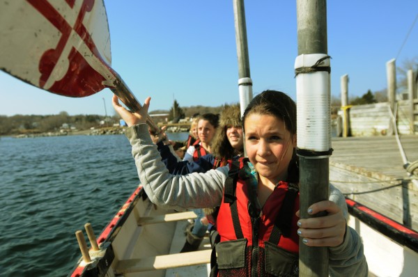 Rockland Middle School seventh-grader Emily Hutchinson hands oars forward to be put away on Tuesday during crew practice. Rockland Middle School seventh-grader Emily Hutchinson hands oars forward to be put away on Tuesday during crew practice.