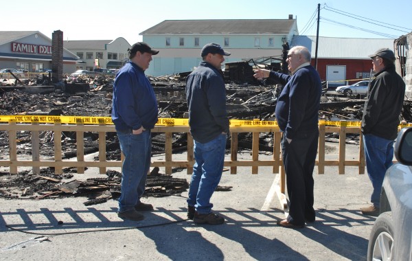 Two generations of the Labbe family look over the pile of rubble that had been Nadeau's House of Furniture on Tuesday, March 27, 2012. The building, along with two others, was destroyed in an early morning fire on Sunday. Ellery "Arms" Labbe (second from right) purchased the furniture business in 1975 and operated with his sons Dave (left), Phil (second from left) and Pat (right). A separate nearby flooring business owned by Dave Labbe was saved. Two generations of the Labbe family look over the pile of rubble that had been Nadeau's House of Furniture on Tuesday, March 27, 2012. The building, along with two others, was destroyed in an early morning fire on Sunday. Ellery "Arms" Labbe (second from right) purchased the furniture business in 1975 and operated with his sons Dave (left), Phil (second from left) and Pat (right). A separate nearby flooring business owned by Dave Labbe was saved.