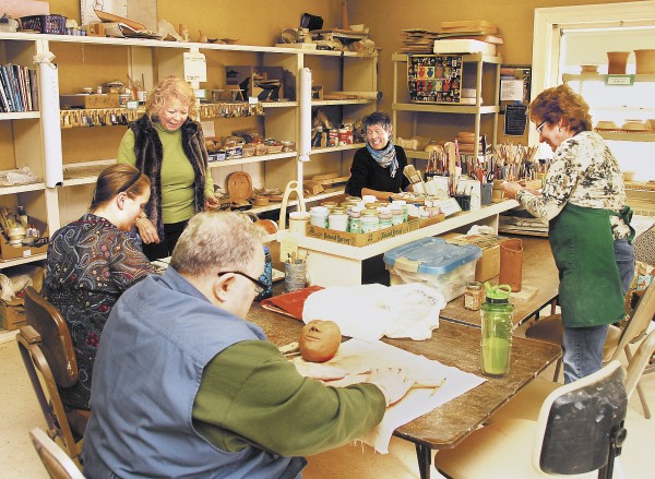 Arts and crafts are very popular at the Center. Here, members work on clay projects. Pottery, painting, sewing, and computer classes are just some of the many other events held regularly, many of which are free (as is Center membership). Visitors come to read, play cribbage or bridge, socialize, and even put on plays.
Arts and crafts are very popular at the Center. Here, members work on clay projects. Pottery, painting, sewing, and computer classes are just some of the many other events held regularly, many of which are free (as is Center membership). Visitors come to read, play cribbage or bridge, socialize, and even put on plays.