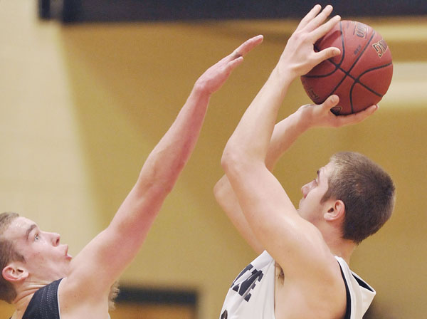 Hampden's Zach Gilpin guards Jonesport-Beals player Garet Beal in a game Saturday, March 17, at the MDI YMCA in Bar Harbor, Maine. Hampden's Zach Gilpin guards Jonesport-Beals player Garet Beal in a game Saturday, March 17, at the MDI YMCA in Bar Harbor, Maine.