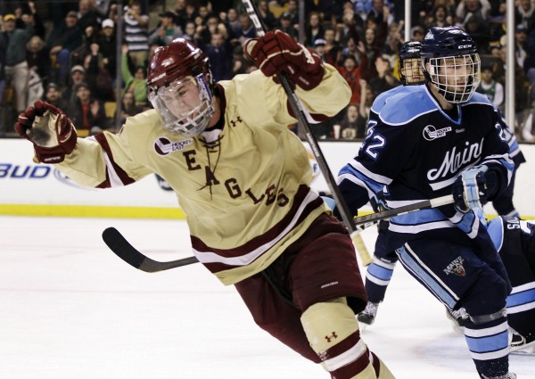 Boston College's Pat Mullane, left, celebrates his goal as Maine's Stu Higgins (22) looks on in the second period of the Hockey East final in Boston, Saturday, March 17, 2012. BC won 4-1. Boston College's Pat Mullane, left, celebrates his goal as Maine's Stu Higgins (22) looks on in the second period of the Hockey East final in Boston, Saturday, March 17, 2012. BC won 4-1.