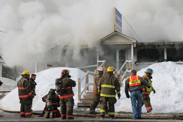 Firefighters from multiple communities work Thursday morning to extinguish a blaze at Cravings restaurant in Grand Isle. Firefighters from multiple communities work Thursday morning to extinguish a blaze at Cravings restaurant in Grand Isle.