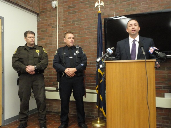 Portland Police Chief Michael Sauschuck addresses the media Wednesday afternoon, March 28, 2012, while Cumberland County Deputy Richard Kimball (left) and Portland Police Officer Daniel Rose look on. Kimball and Rose successfully restrained a man wielding a gun on Forest Avenue the morning of March 27. Portland Police Chief Michael Sauschuck addresses the media Wednesday afternoon, March 28, 2012, while Cumberland County Deputy Richard Kimball (left) and Portland Police Officer Daniel Rose look on. Kimball and Rose successfully restrained a man wielding a gun on Forest Avenue the morning of March 27.