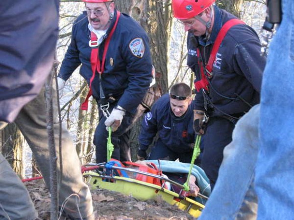 Barbara Cormier, 63, of Canton holds onto the rail of a litter basket while being pulled up an 80- to 100-foot embankment Tuesday , March 27, 20112 behind Walmart in Mexico. Rumford Fire Department Rope Rescue Team members, Deputy Chief Richard Coulombe (left) and Lt. Rob Dixon, and a Med-Care Ambulance crewman at the bottom of the litter helped with the rescue. Barbara Cormier, 63, of Canton holds onto the rail of a litter basket while being pulled up an 80- to 100-foot embankment Tuesday , March 27, 20112 behind Walmart in Mexico. Rumford Fire Department Rope Rescue Team members, Deputy Chief Richard Coulombe (left) and Lt. Rob Dixon, and a Med-Care Ambulance crewman at the bottom of the litter helped with the rescue.