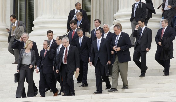 States' attorney generals walk down the steps of the U.S. Supreme Court in Washington on Thursday at the end of arguments on the constitutionality of the health care law signed by President Barack Obama. States' attorney generals walk down the steps of the U.S. Supreme Court in Washington on Thursday at the end of arguments on the constitutionality of the health care law signed by President Barack Obama.