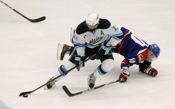 UMass Lowell's David Vallorani (right) falls onto the ice as he battles for the puck with the University of Maine's Spencer Abbott during the third period of the game in Orono in November 2011. Abbott was chosen as the Hockey East’s Player of the Year and one of the 10 Hobey Baker Award finalists. UMass Lowell's David Vallorani (right) falls onto the ice as he battles for the puck with the University of Maine's Spencer Abbott during the third period of the game in Orono in November 2011. Abbott was chosen as the Hockey East’s Player of the Year and one of the 10 Hobey Baker Award finalists.