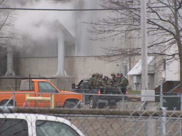 A team of State Police tactical officers were transported into the Verso Mill in Jay Wednesday by pickup truck. The officers are responding to standoff and hostage situation at the mill. A team of State Police tactical officers were transported into the Verso Mill in Jay Wednesday by pickup truck. The officers are responding to standoff and hostage situation at the mill.
