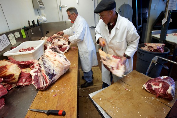 Brothers Roger (left) and Ray Bisson, two of 11 siblings, cut beef raised on their family's farm in Topsham on Thursday, March 8, 2012. The farm currently has 200 beef cattle and 100 dairy cows, 60 of which are milking. Brothers Roger (left) and Ray Bisson, two of 11 siblings, cut beef raised on their family's farm in Topsham on Thursday, March 8, 2012. The farm currently has 200 beef cattle and 100 dairy cows, 60 of which are milking.