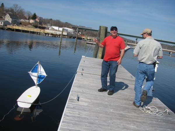 Dick Baldwin of Educational Passages tests one of his nonprofit group's miniboats to determine whether a recently installed portable receiver designed to pick up information from transmitters implanted in Atlantic salmon is working. Graham Goulette, a fisheries biologist at the NOAA field station in Orono, worked next to him Thursday, March 22, 2012. Dick Baldwin of Educational Passages tests one of his nonprofit group's miniboats to determine whether a recently installed portable receiver designed to pick up information from transmitters implanted in Atlantic salmon is working. Graham Goulette, a fisheries biologist at the NOAA field station in Orono, worked next to him Thursday, March 22, 2012.