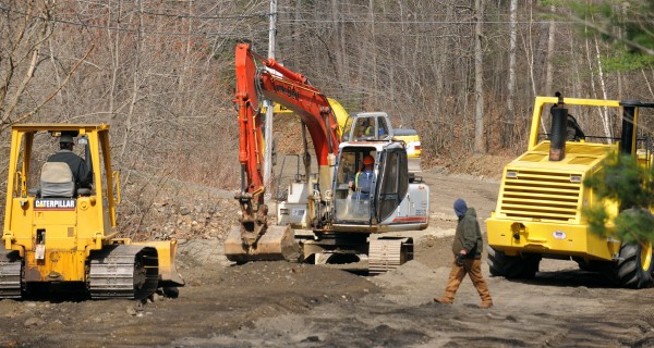 Construction crews work on repairing the Swetts Pond Road in Orrington on Monday, March 27, 2012. The roadway and several driveways were washed away when a beaver dam burst Friday evening. Construction crews work on repairing the Swetts Pond Road in Orrington on Monday, March 27, 2012. The roadway and several driveways were washed away when a beaver dam burst Friday evening.