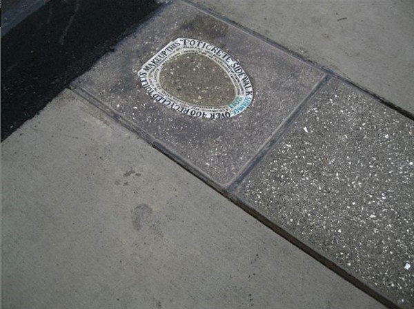 An inscribed toilet seat is embedded into a Bellingham, Wash., sidewalk, making note of the 400 toilets that were crushed and mixed into a new poticrete sidewalk there. An inscribed toilet seat is embedded into a Bellingham, Wash., sidewalk, making note of the 400 toilets that were crushed and mixed into a new poticrete sidewalk there.