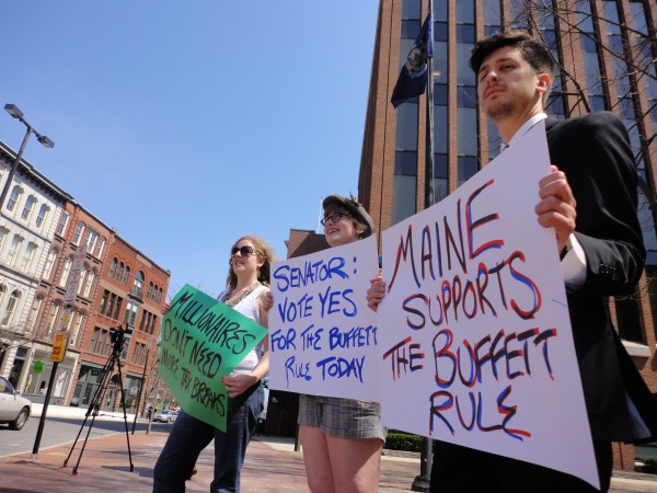 Delia Gorham (from left), Kaiulani Anderson-Andrei and Wells Lyons hold up signs near Canal Plaza in Portland around midday Monday, April 16, 2012, representing the Maine League of Young Voters. The league held the demonstration to raise awareness of the "Buffett Rule," in which millionaires in America would be taxed a consistent 30 percent on income. Delia Gorham (from left), Kaiulani Anderson-Andrei and Wells Lyons hold up signs near Canal Plaza in Portland around midday Monday, April 16, 2012, representing the Maine League of Young Voters. The league held the demonstration to raise awareness of the "Buffett Rule," in which millionaires in America would be taxed a consistent 30 percent on income.