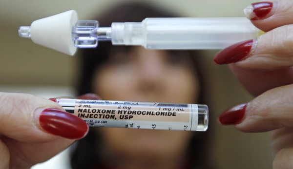 In this Tuesday Feb. 27, 2012 photo, Kathy Deady holds up a tube of Naloxone Hydrochloride, also known as Narcan, in her Quincy, Mass., home. Narcan is a nasal spray used as an antidote for opiate drug overdoses. Deady twice had to use the drug on her son, who was suffering from an overdose of heroin. The drug counteracts the effects of heroin, OxyContin and other powerful painkillers and has been routinely used by ambulance crews and emergency rooms in the U.S. and other countries for decades. But in the past few years, public health officials across the nation have been distributing it free to addicts and their loved ones, as well as to some police and firefighters. In this Tuesday Feb. 27, 2012 photo, Kathy Deady holds up a tube of Naloxone Hydrochloride, also known as Narcan, in her Quincy, Mass., home. Narcan is a nasal spray used as an antidote for opiate drug overdoses. Deady twice had to use the drug on her son, who was suffering from an overdose of heroin. The drug counteracts the effects of heroin, OxyContin and other powerful painkillers and has been routinely used by ambulance crews and emergency rooms in the U.S. and other countries for decades. But in the past few years, public health officials across the nation have been distributing it free to addicts and their loved ones, as well as to some police and firefighters.